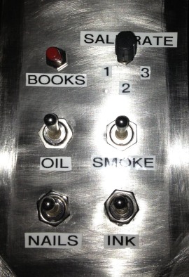 This switch panel runs the seat heaters -- as well as fictitious secret weapons.